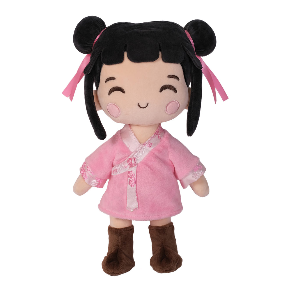 Nini Asian plush doll with black hair, pink ribbons, a pink outfit, and brown boots